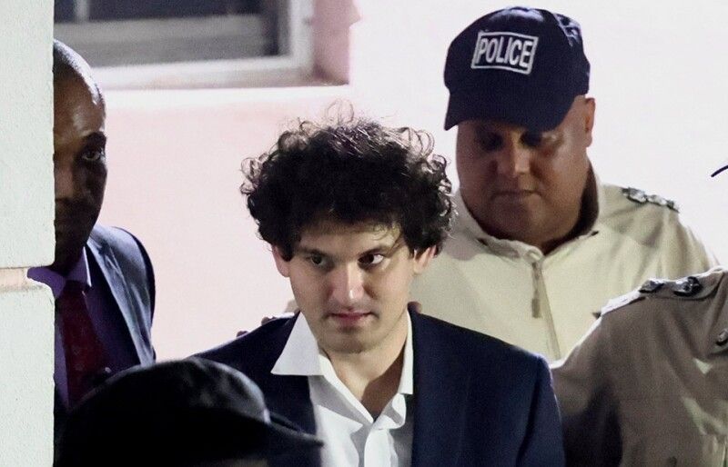 Sam Bankman-Fried escorted by authorities